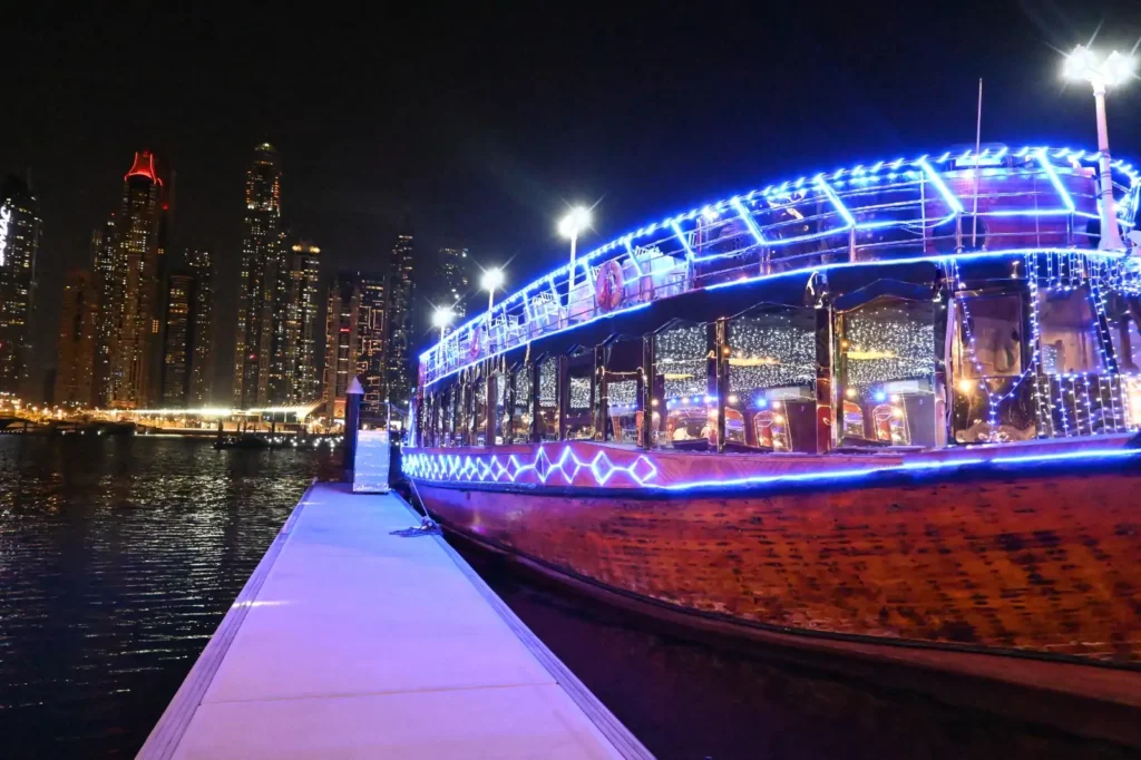 Guests enjoying a Dhow Dinner Cruise Dubai Marina with live entertainment and panoramic marina views