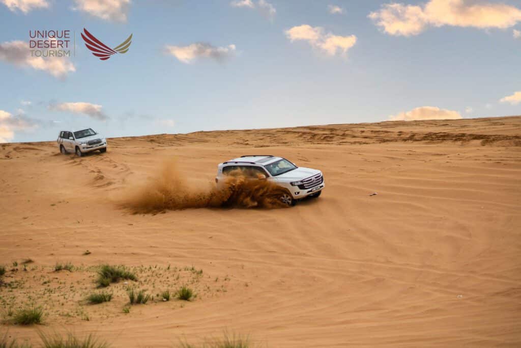 Tourist arriving at meeting point for self-drive desert safari Dubai with shared 4x4 vehicles